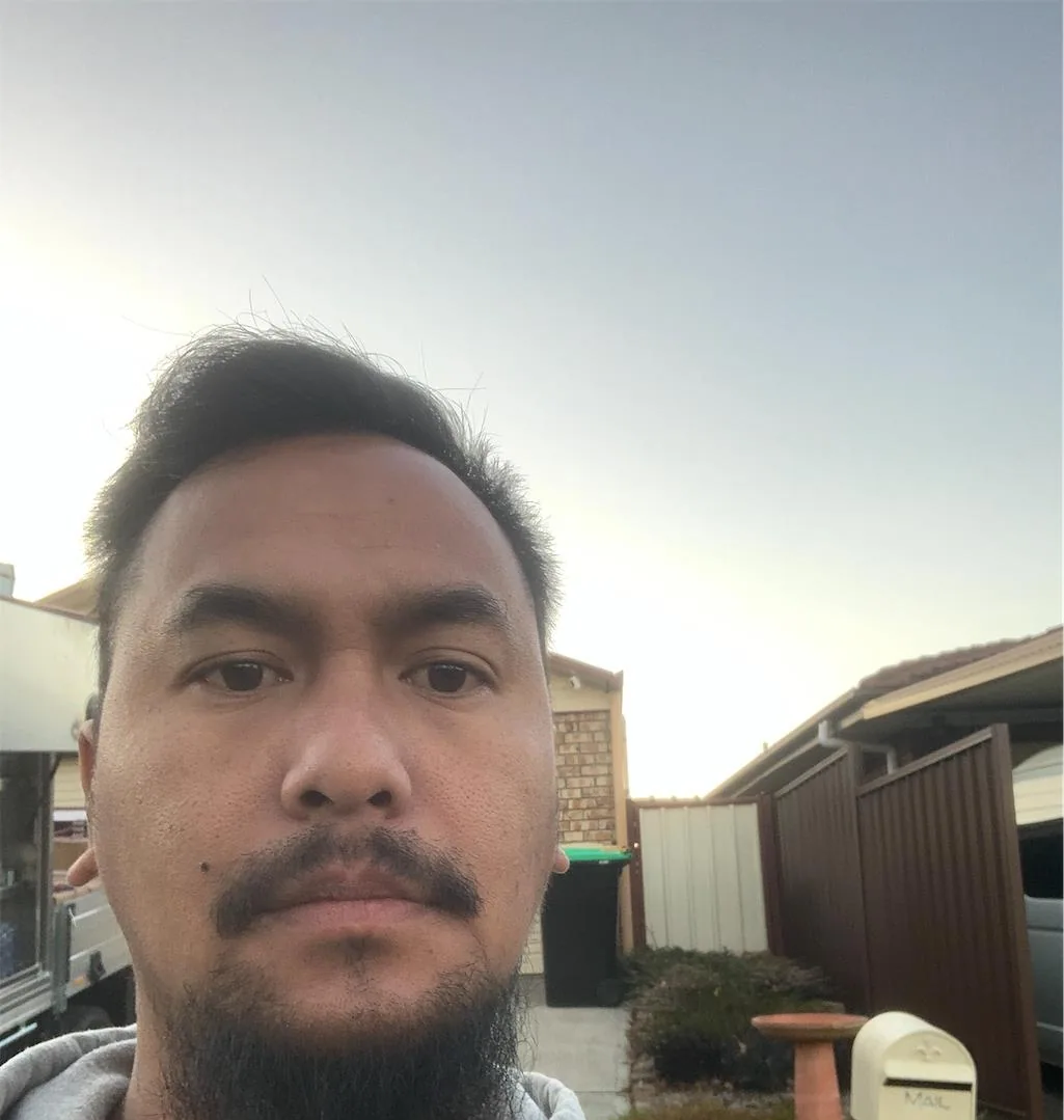 Solar installation worker on site beside residential solar panels, project photo 32