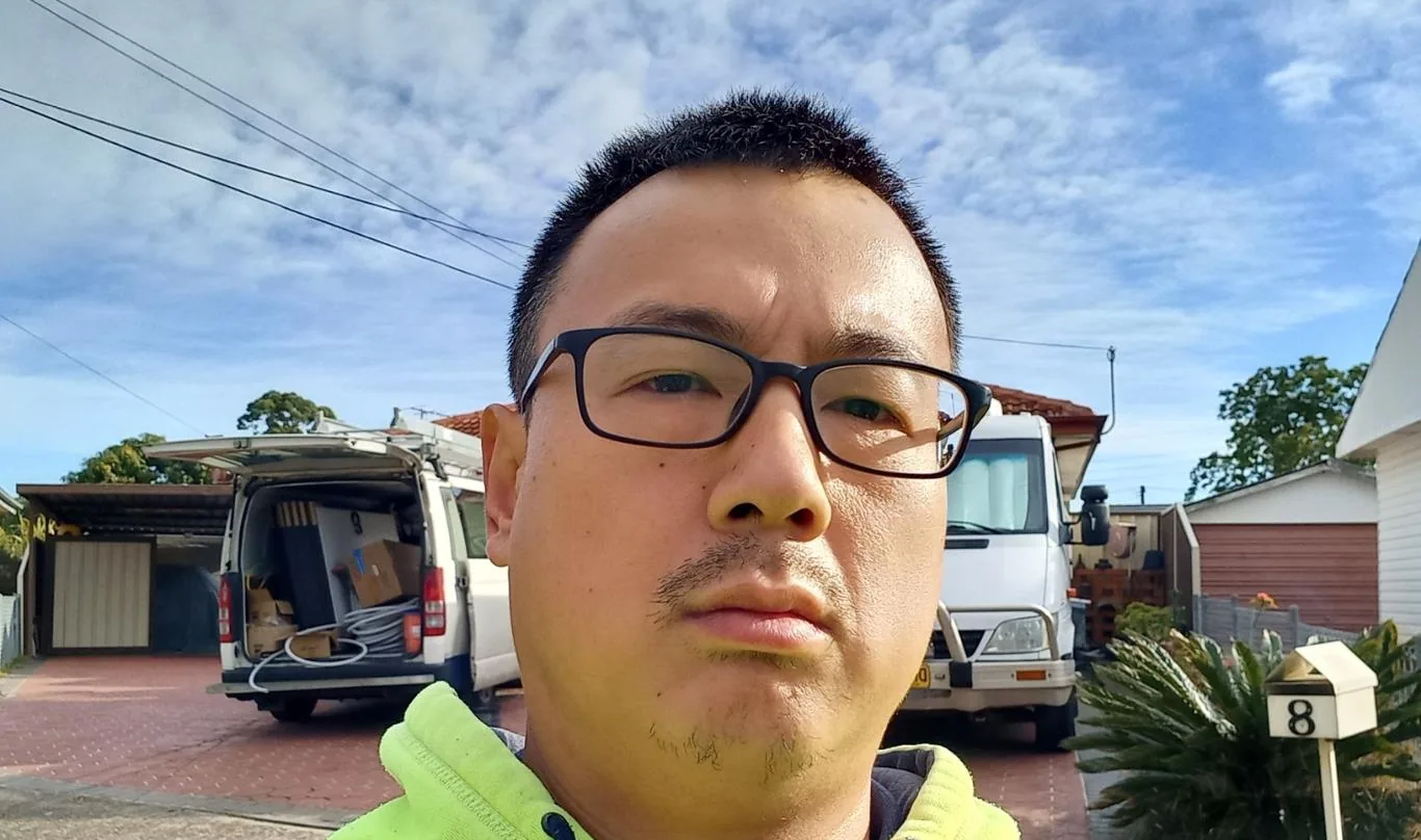 Solar installation worker on site beside residential solar panels, project photo 44