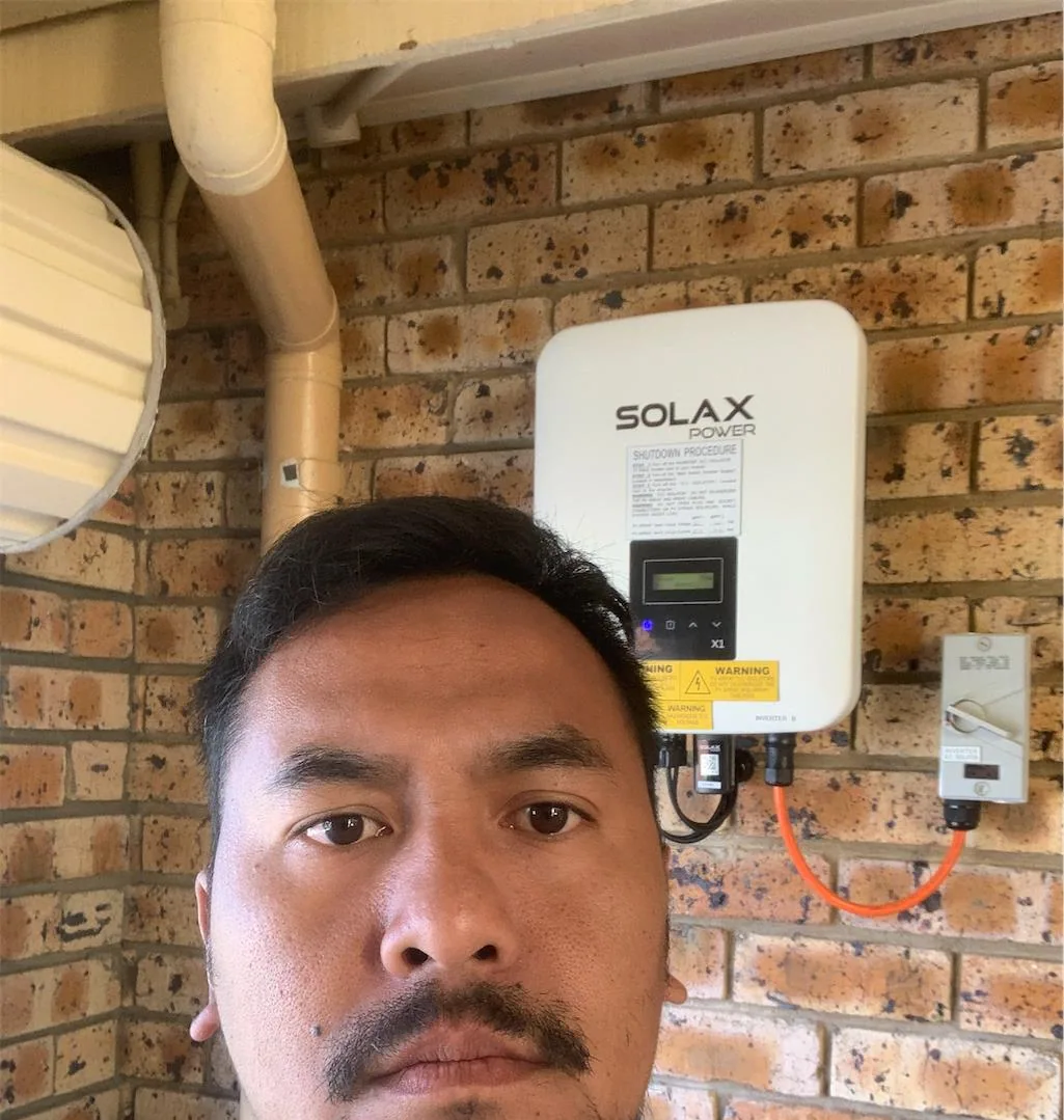 Solar installation worker on site beside residential solar panels, project photo 62