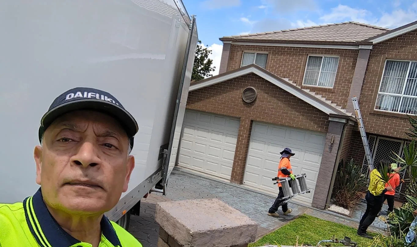 Solar installation worker on site beside residential solar panels, project photo 64